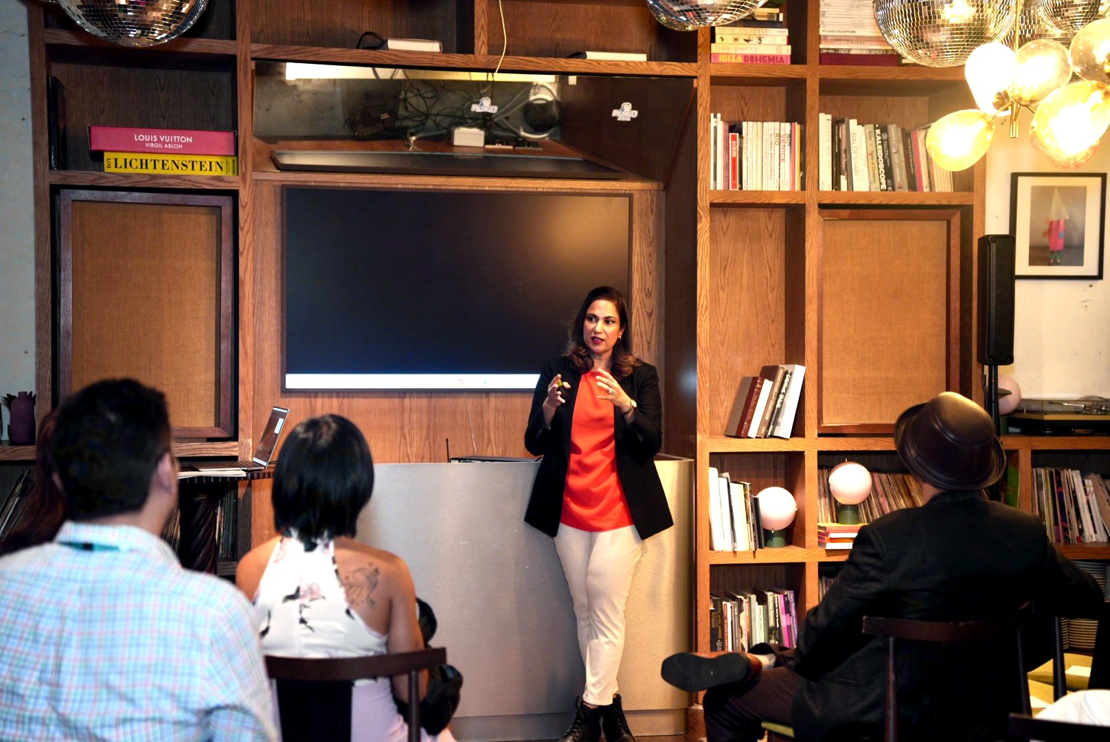 Shazaf Moonis leading a Single Safety conversation in a room of people